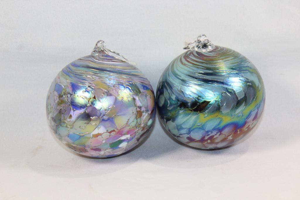 2 PC. IRIDESCENT BLUE ART GLASS HANGING ORNAMENT: MEASURES APPROX. 5 BY 4 INCHES. NO VISIBLE CHIPS OR CRACKS. AS PICTURED