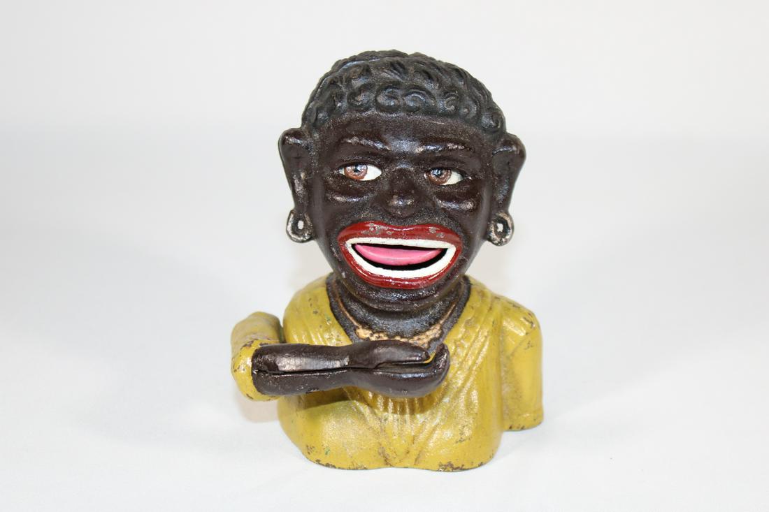 John Harper Black Americana Dinah Mechanical Bank: Cast Iron Mechanical Bank - made by John Harper and Co c. 1911; long sleeved yellow shirt, WORKS; measures about 5 3/4 inches tall