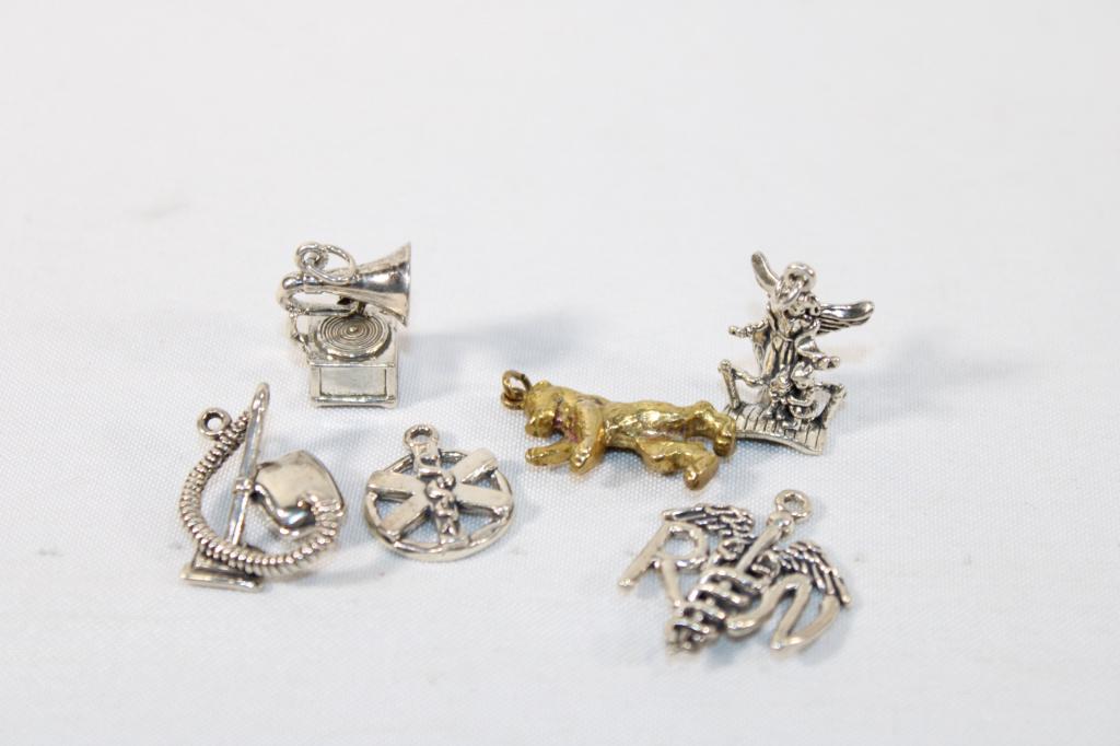 Lot of Sterling Silver Bracelet Charms: as pictured; weighs about .85 toz