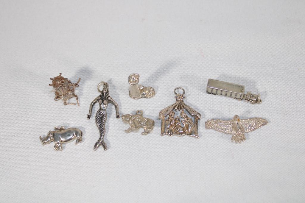 Lot of 8 Sterling Silver charms: approximately 1.14 TOZ