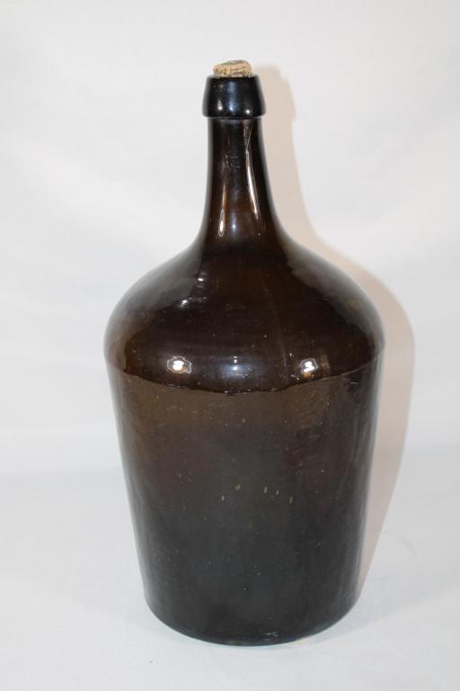 Antique Dark Amber Glass Bottle w/ Cork: Good overall as pictured. Measures about 14.25" tall.