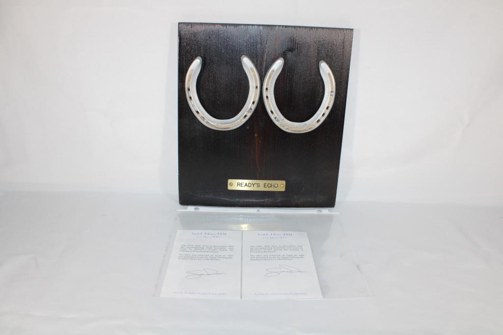 Ready's Echo Pair of Horshoes Keeneland Racetrack: Pair of hind horseshoes worn by Ready's Echo during training at Keeneland Racetrack. Removed on April 18,2009. Measures about 11" x 12".