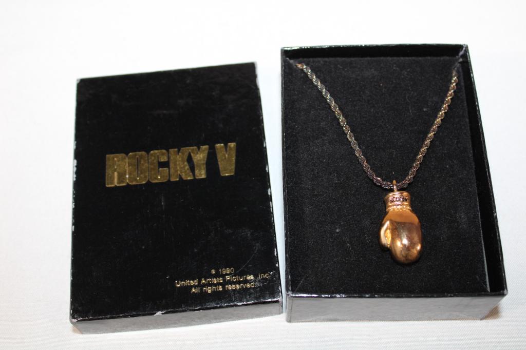Rocky V Glove Charm and Necklace Sterling: Both pieces are marked sterling. Good overall as pictured. Weighs 0.69 Troy ounces.