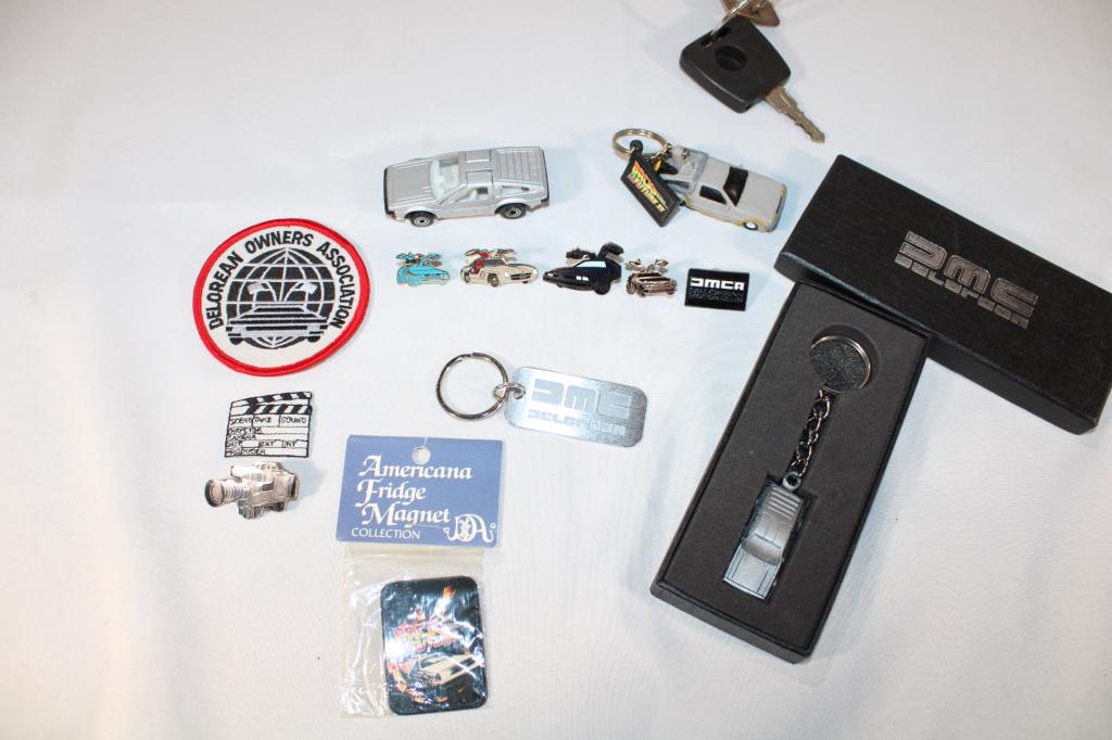 Lot of Delorean Items- Keychains, patches, pins et: includes: keychain, patches, key, pins, mini cars etc as pictured