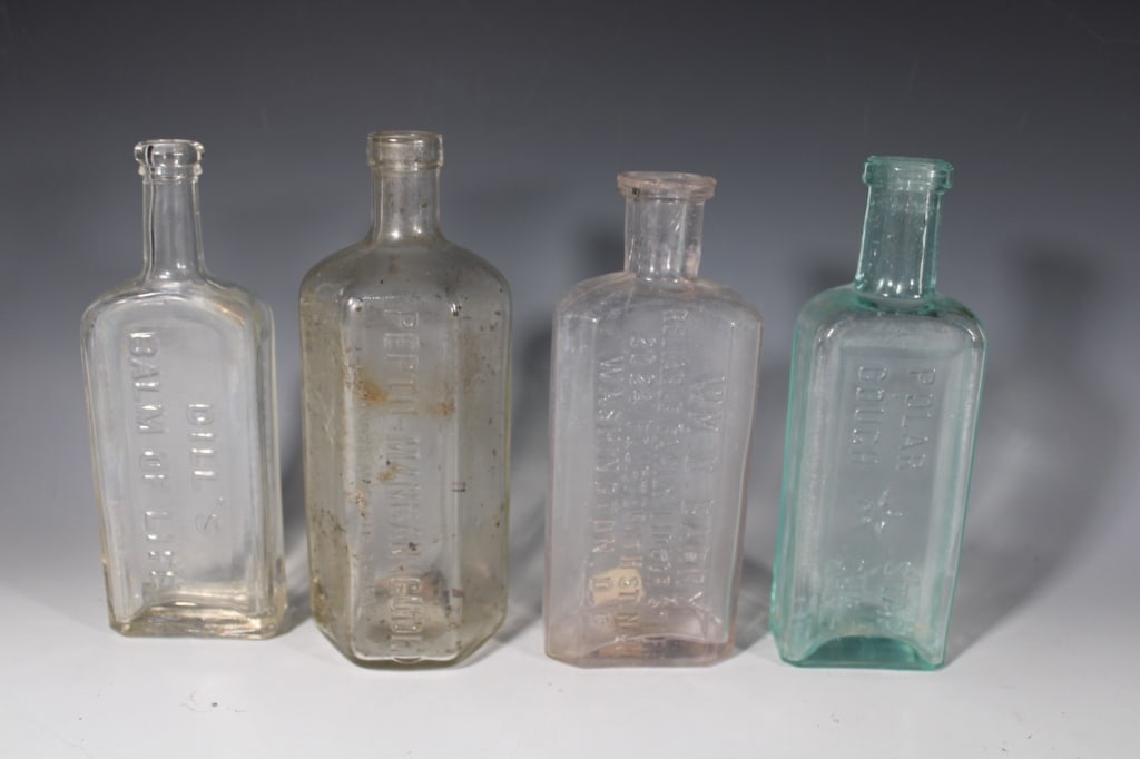 Lot of 4 Antique Medicine Bottles: Dill's Balm of Life, Pepto-Mangan, WM D Barry, Polar Cough. Good overall as pictured.