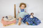 Two antique dolls with clothes