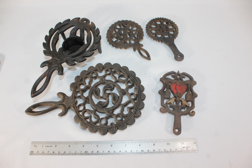 Large lot of cast iron trivets (1 of 1)