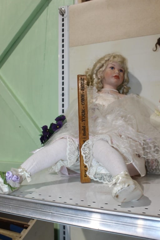 Large Porcelain doll sitting with stockings (1 of 1)