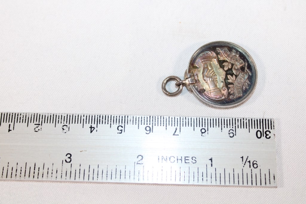 C 1909 Wells Motto Sterling Metal charm (1 of 2)