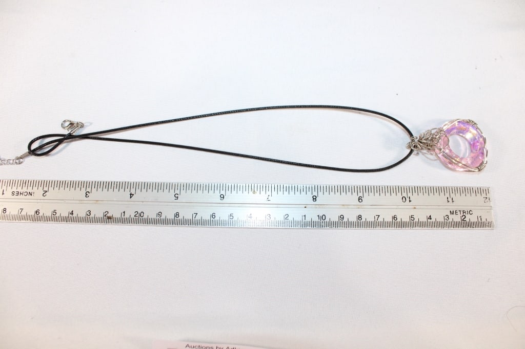Crystal and twisted metal pendant on rope necklace: Good overall condition