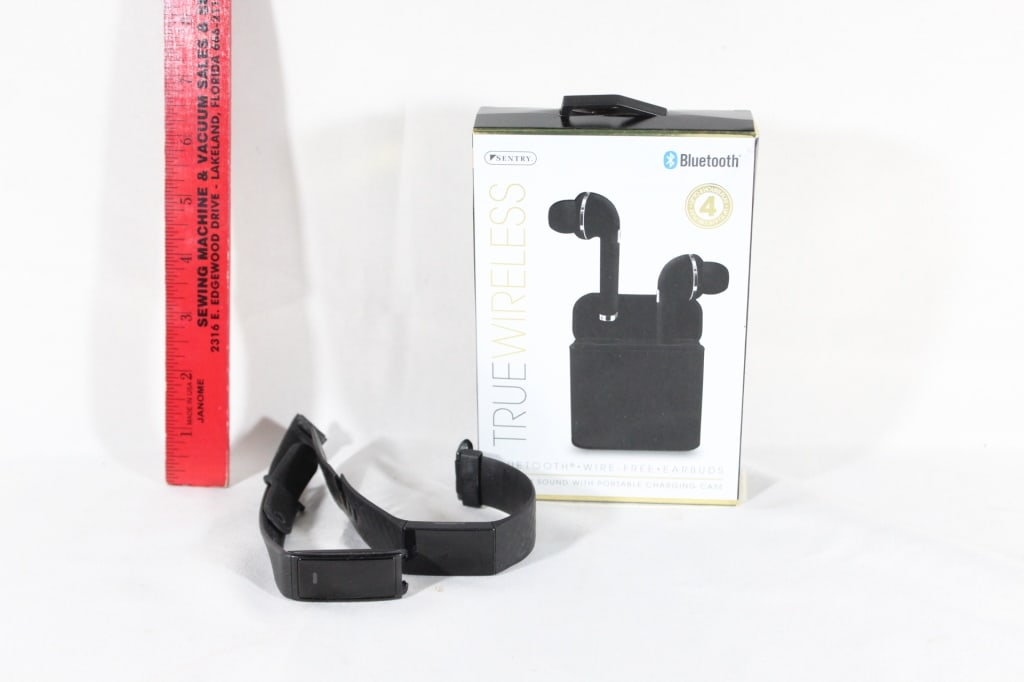 Two fitbit watches,bluetooth wireless earbuds (1 of 3)