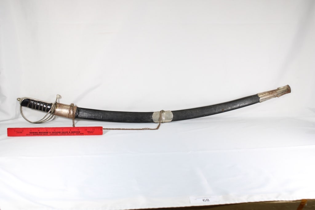 Vintage Replica Calvary Sword Made in India: Leather Wrapped Hilt & Scabbord .Silver Metal Locket & Chappe with Etched Blade Overall Length- 41" Blade Length - 31"
