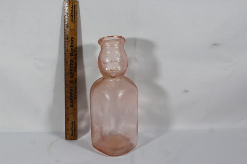 Pink Depression Glass Baby Faced Milk Bottle: good overall as pictured