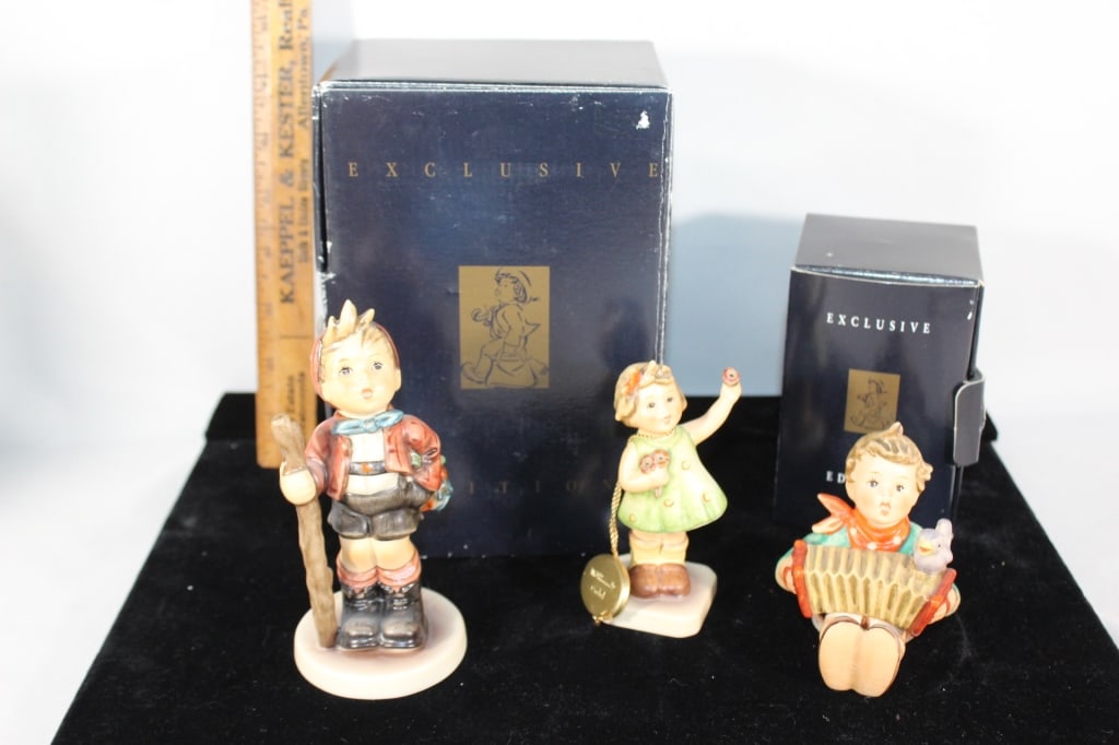 Two M.J. Hummel Exclusive edition figurines (1 of 4)