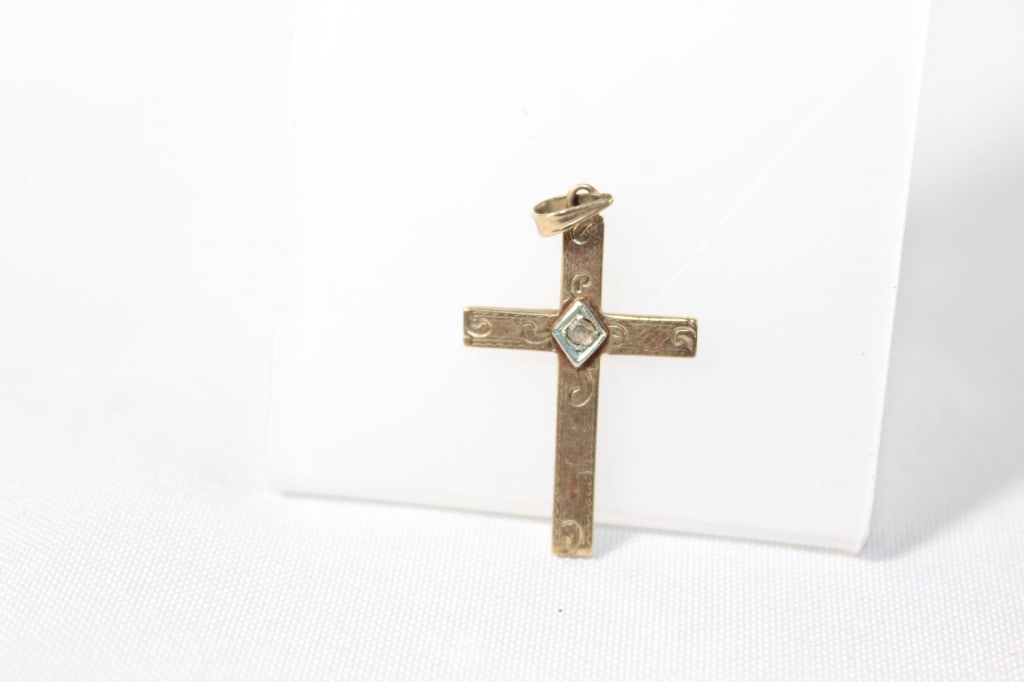 10 karat Gold Cross Pendant: weighs about .80 grams; marked Jason 10kt