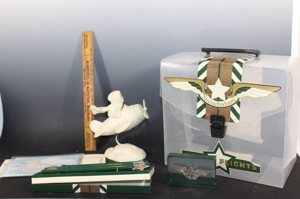 Snowbabies Frosty Flights Friendship club: with plastic carrying case, collectible pencils,pin, etc. Figurine roughly 6.5 inches tall Good overall as pictured *Proceeds from this lot benefit the Rotary Club of