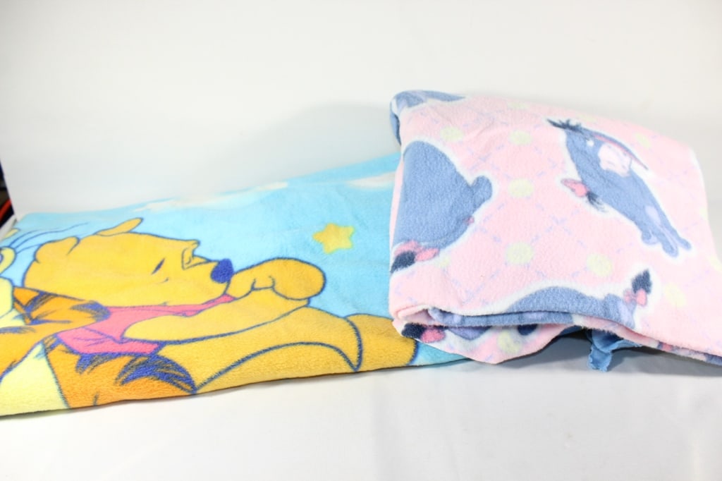 Pair - Winnie of Pooh Blankets - Eyeore etc.: Good overall as pictured *Proceeds from this lot benefit the Rotary Club of Greater Gainesville (Fla.)