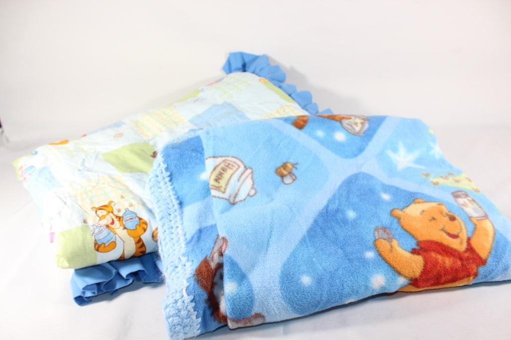 Pair of Winnie the Pooh Blankets: Good overall as pictured; *Proceeds from this lot benefit the Rotary Club of Greater Gainesville (Fla.)