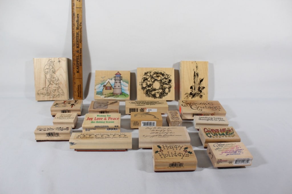 Large lot of wooden ink stamps: Joy Love Peace, Season's Greetings, Happy Holidays and many more. Nineteen total *Proceeds from this lot benefit the Rotary Club of Greater Gainesville (Fla.)