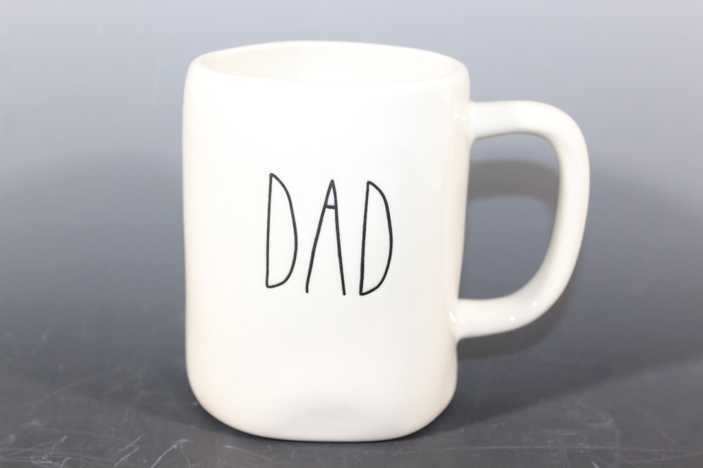Rae Dunn Artisan Collection Coffee Cup: Cup has 'dad' on the outside. Measures approximately 5 inches tall and 3 1/2 inches at its widest.