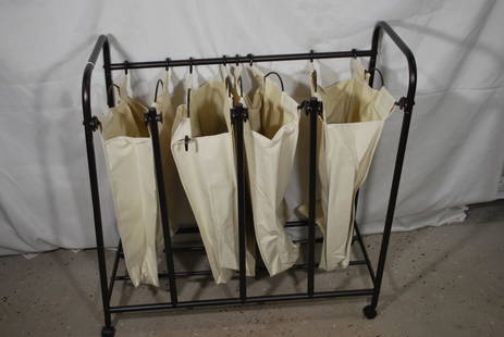 Metal and Canvas Rolling Laundry Cart: 32 inches wide by 33 inches tall; Proceeds from this lot benefit the Rotary Club of Greater Gainesville (Fla.)