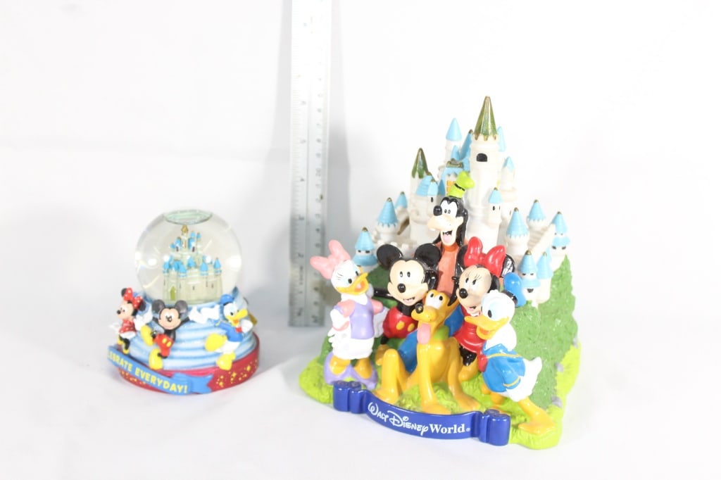 Walt Disney World plastic piggy bank and snowglobe: Globe roughly measures 3 inches tall-Bank 7 inches tall Good overall as pictured