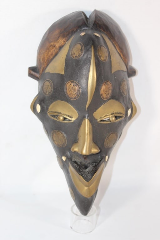 African Tribal Mask with Embedded Coins - 1925 etc: varitey of coins - dated 1923, 1925, 1924, 1926 etc. ; about 12 inches tall; also embedded with metal on nose, lips, eyes