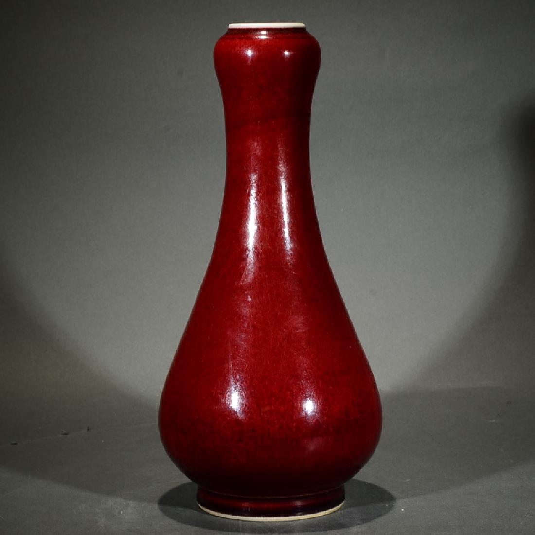A RED GLAZED GOURD HEAD VASE (1 of 4)