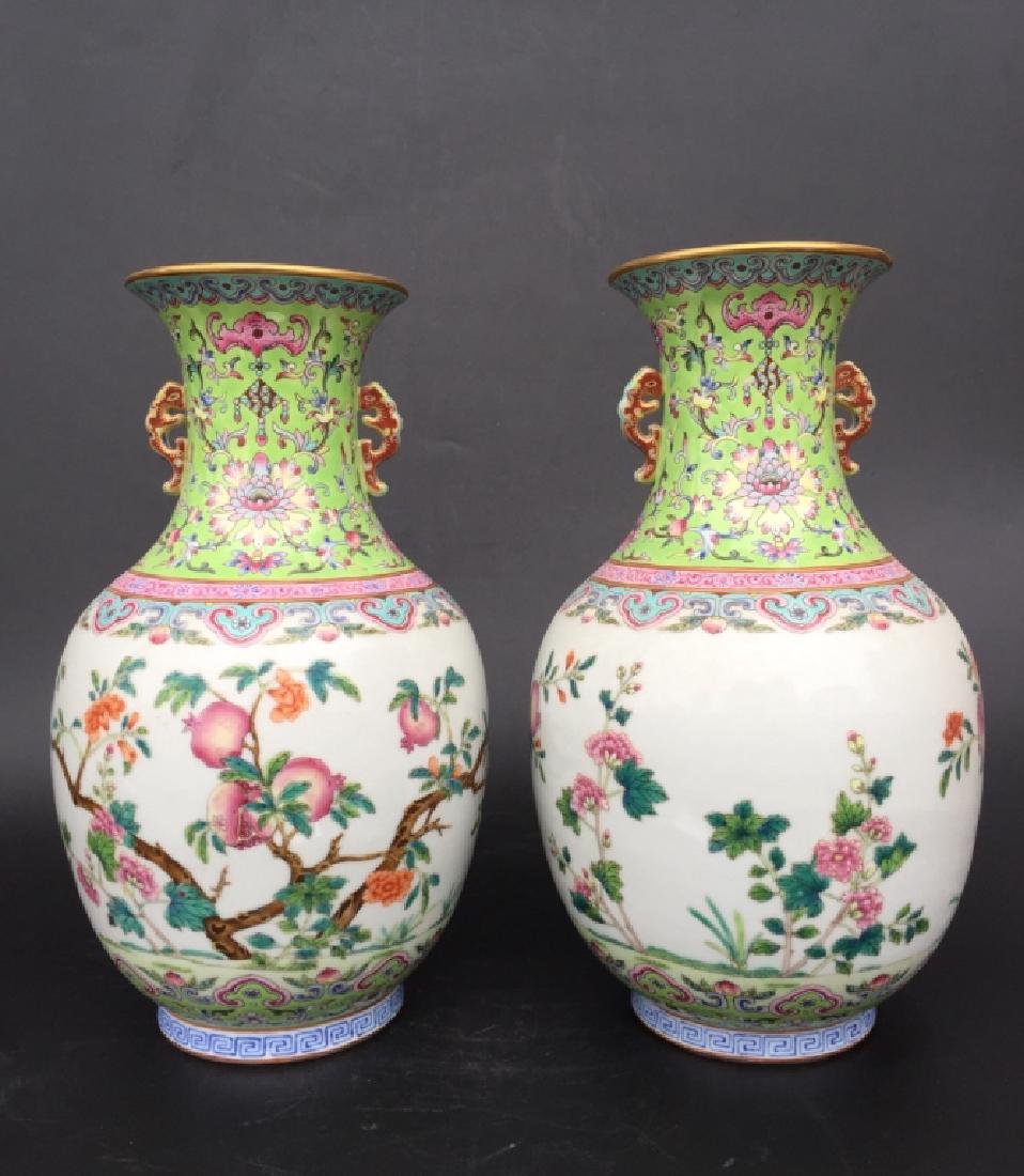 PAIR OF GREEN GROUND FAMILLE ROSE VASES (1 of 8)