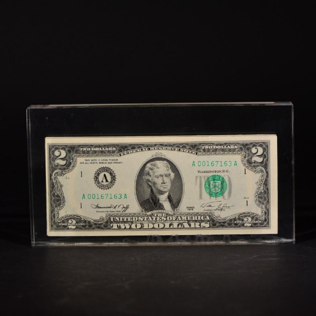 A SET OF ONE HUNDRED TWO DOLLAR BILLS: a set of one hundred two dllar bills was printed at the period of founding the United States