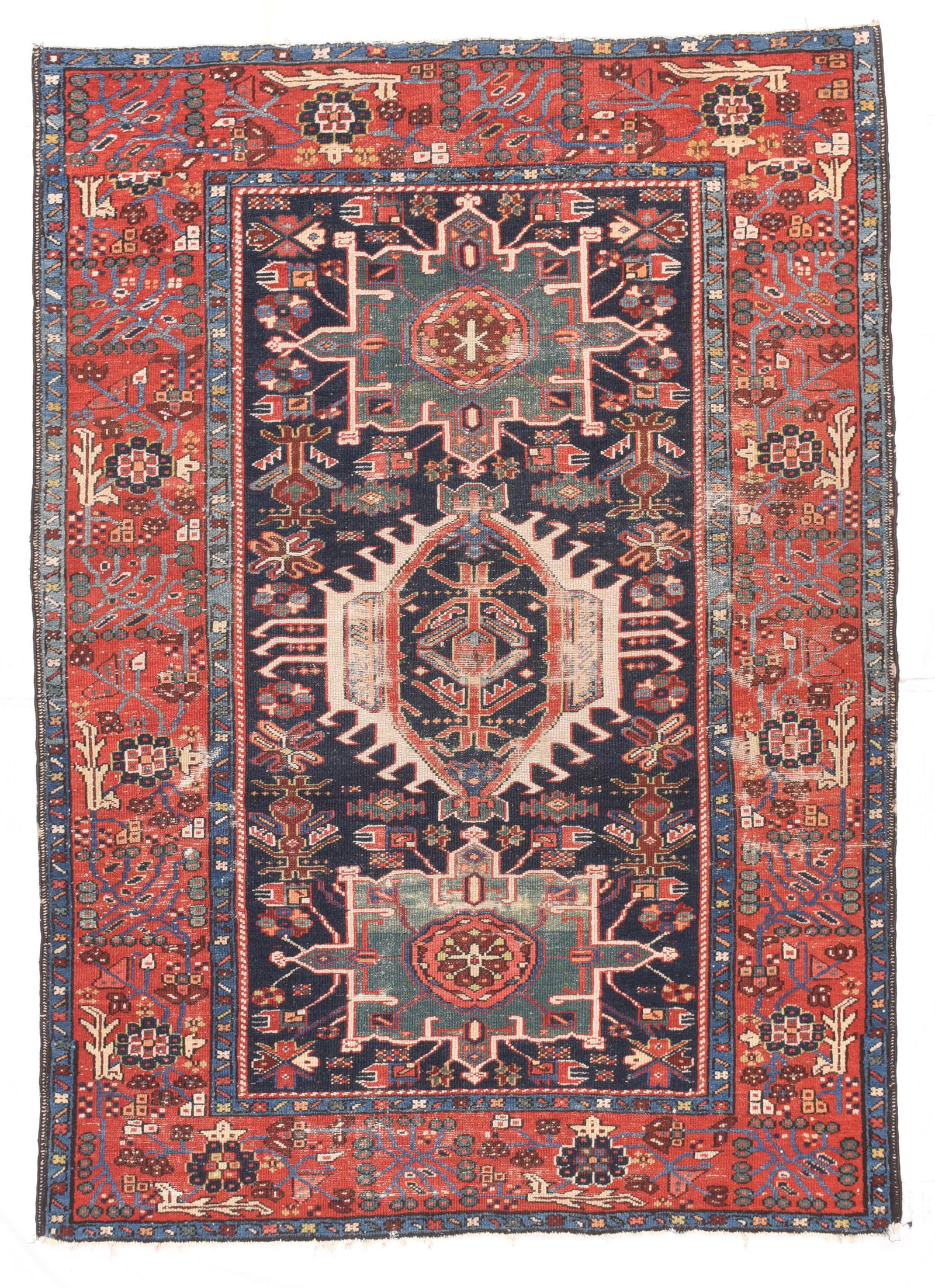 Fine Antique Persian Karaje Heriz - 4'7'' X 6'3'': This well-drawn, classic NW Persian village scatter shows areas of wear in the centre, but still shows excellent natural colours including a composite green. Dark blue field with two octogrammes flank