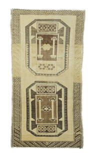 Turkish Rug, 2' x 3'10": On the plain straw field are set two large octagons with red central squares. Six petal rosettes decorate the squares and extra panels above and below. Umber details and strong lighter edge-to-edge