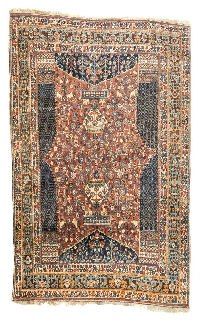 Antique Qashqai Rug, 5'3'' x 8'4'' (1.60 x 2.54 m): Five reversing rows of profile carnation detailed in red and cream decorate the lightly abrashed royal blue field of this east Caucasian all wool scatter with natural dyes. Characteristic red Zeychur