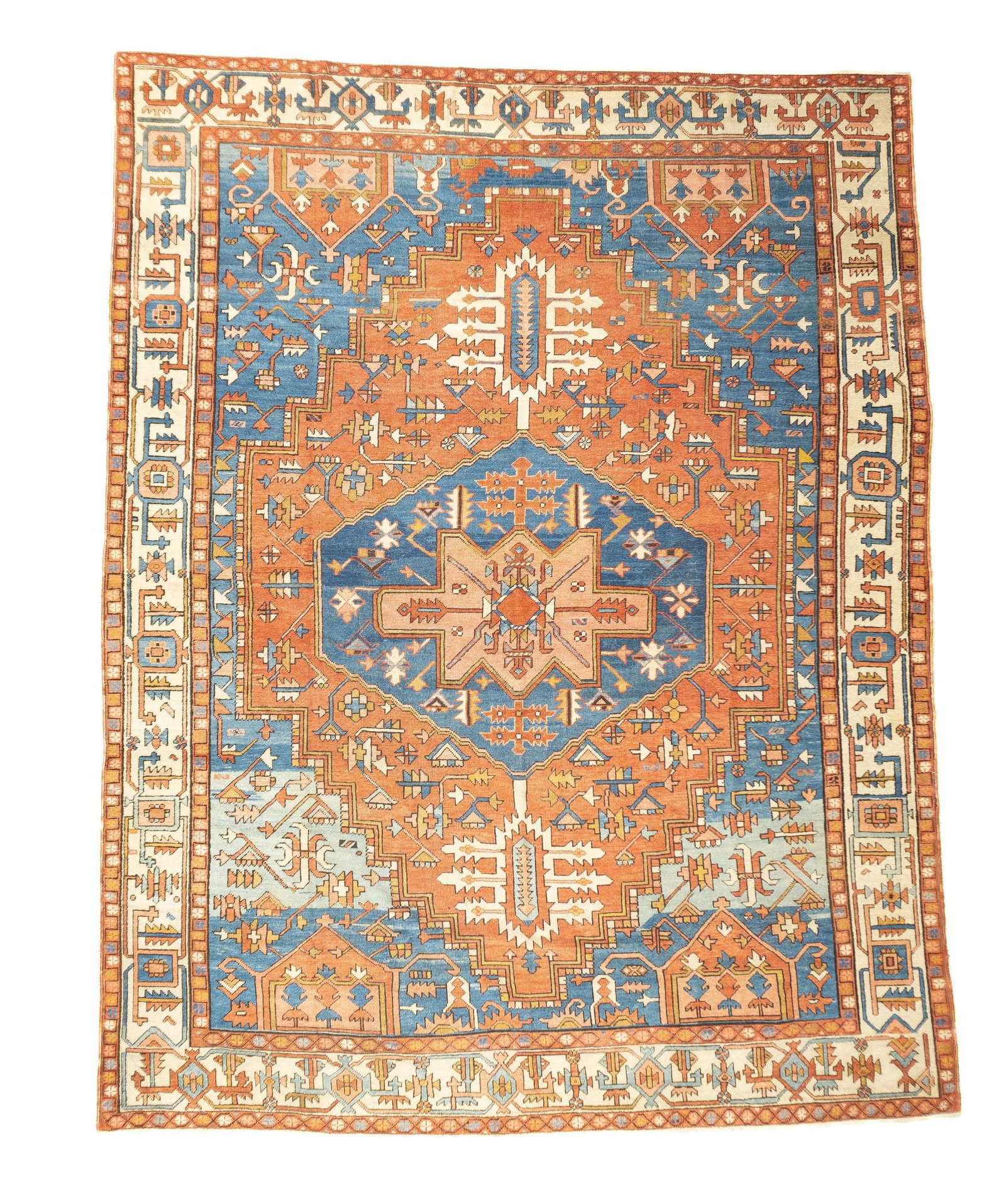 Antique Serapi Rug, 9'7" x 12'3" ( 2.92 x 3.73 M ): The light blue field panel abrashes in two sections to a powder blue. Two rust pentagonal lappets enliven each end. The rust field is centred by an hexagonal dark medallion with powder blue and ecru p