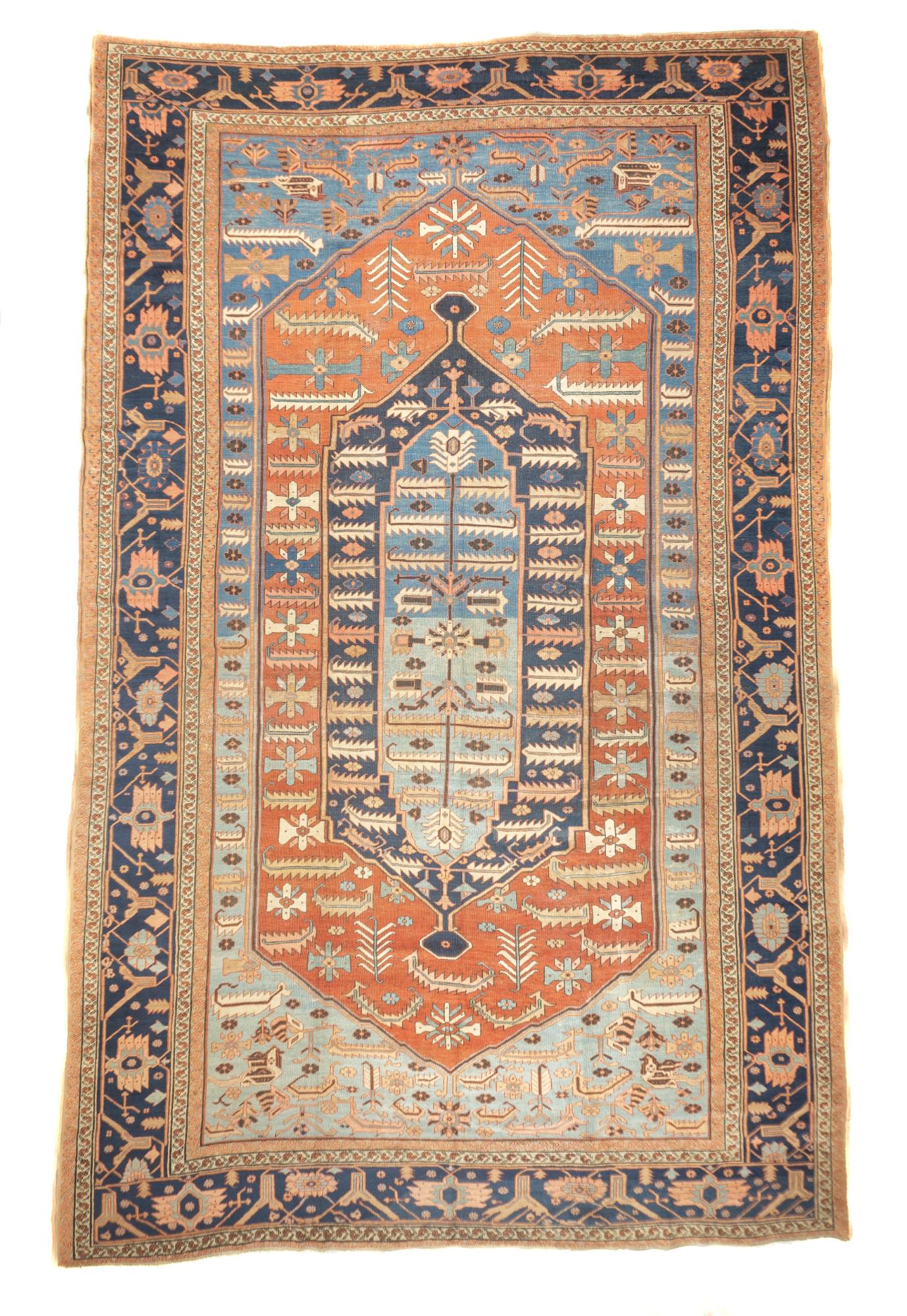 Antique Bakhshaish Rug, 11'5" x 18'3" ( 3.48 x 5.56 M ): The field abrashes from powder to light blue, and shows a tall red hexagonal panel decorated with rosettes and barbed straight leaves, enclosing concentric navy and light blue-powder medallions, with