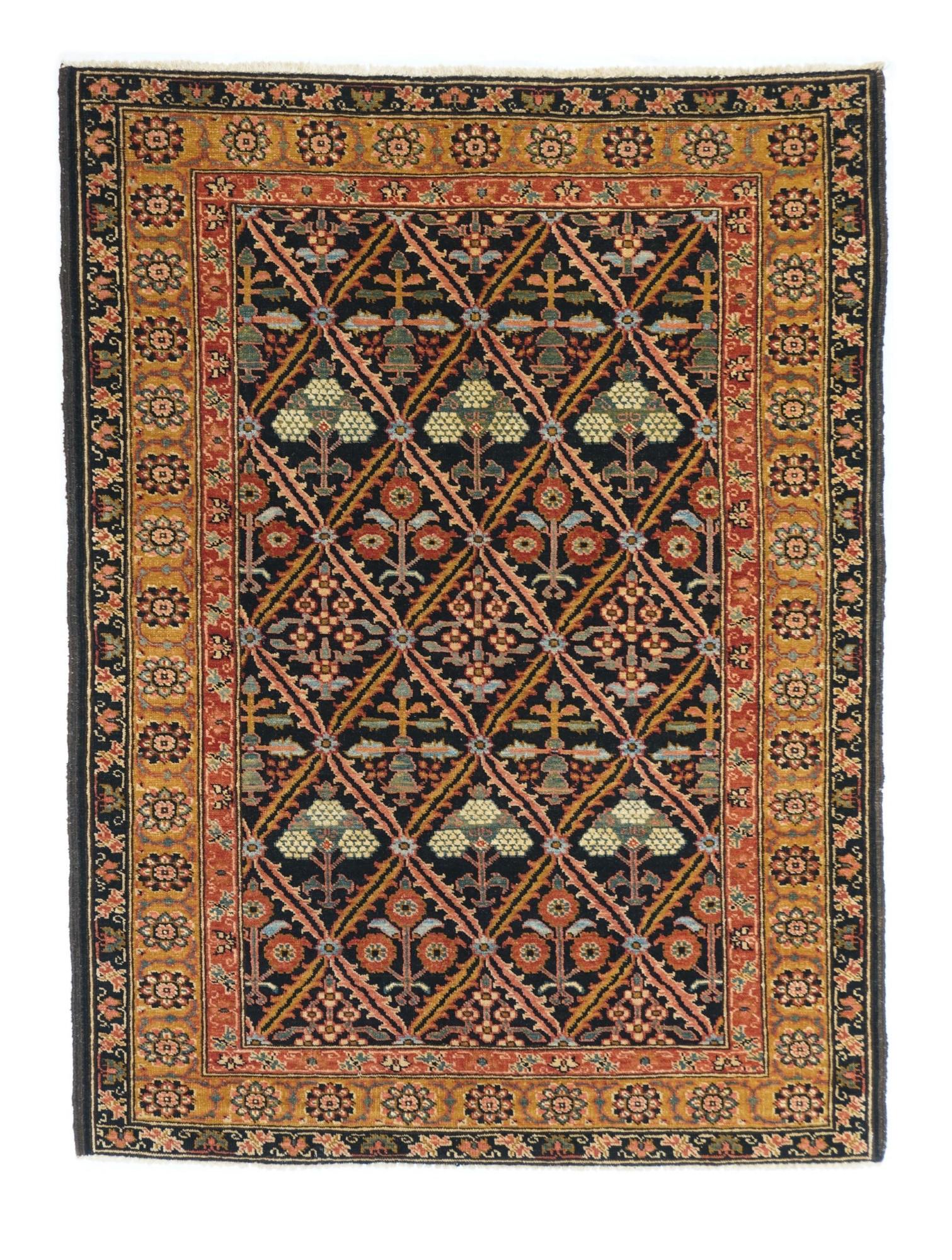Persian Bakhshayesh Rug, 4'1" x 5'10" (1.24 x 1.78 M): This antique rustic NW Persian scatter presents a deep blue serrated leaf lozenge lattice enclosing four distinct row styles of flowers including poppies and prunus. Straw-gold rosette border. Excelle