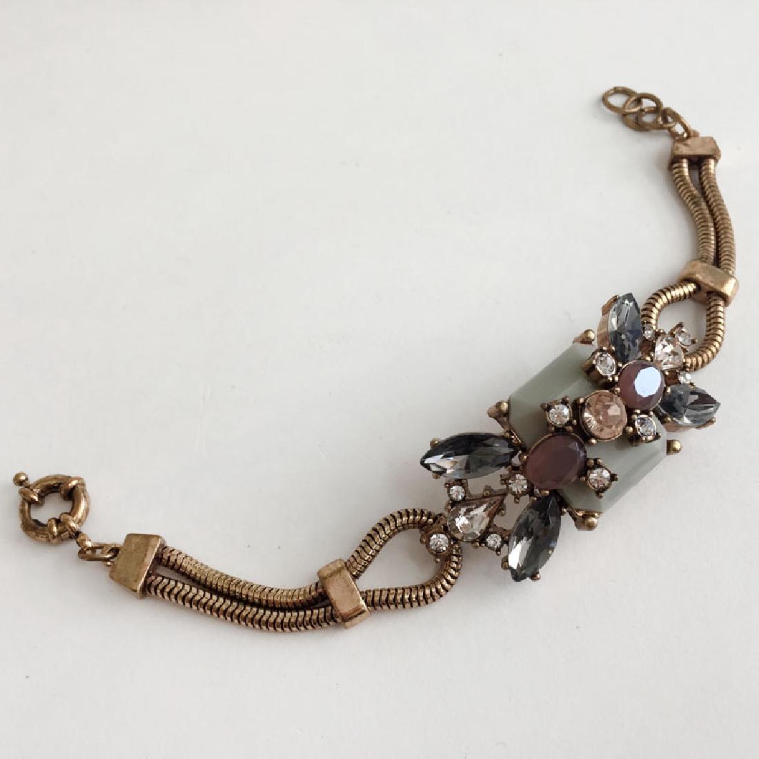 Antique color chain bracelet with multi colors and: Antique color chain bracelet with multi colors and shapes rhinestones. Length maximum 8 1/2". Part with stones measured in length 2 1/4". Condition very good.