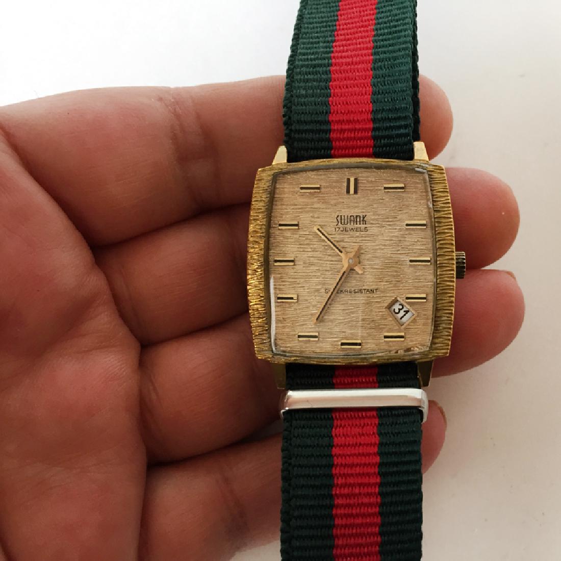 Vintage gold tone textured cushion shape SWANK 17: Vintage gold tone textured cushion shape SWANK 17 jewels Date Shock resistant, France watch. Watch is working. Condition very good, crystal with no scratches.