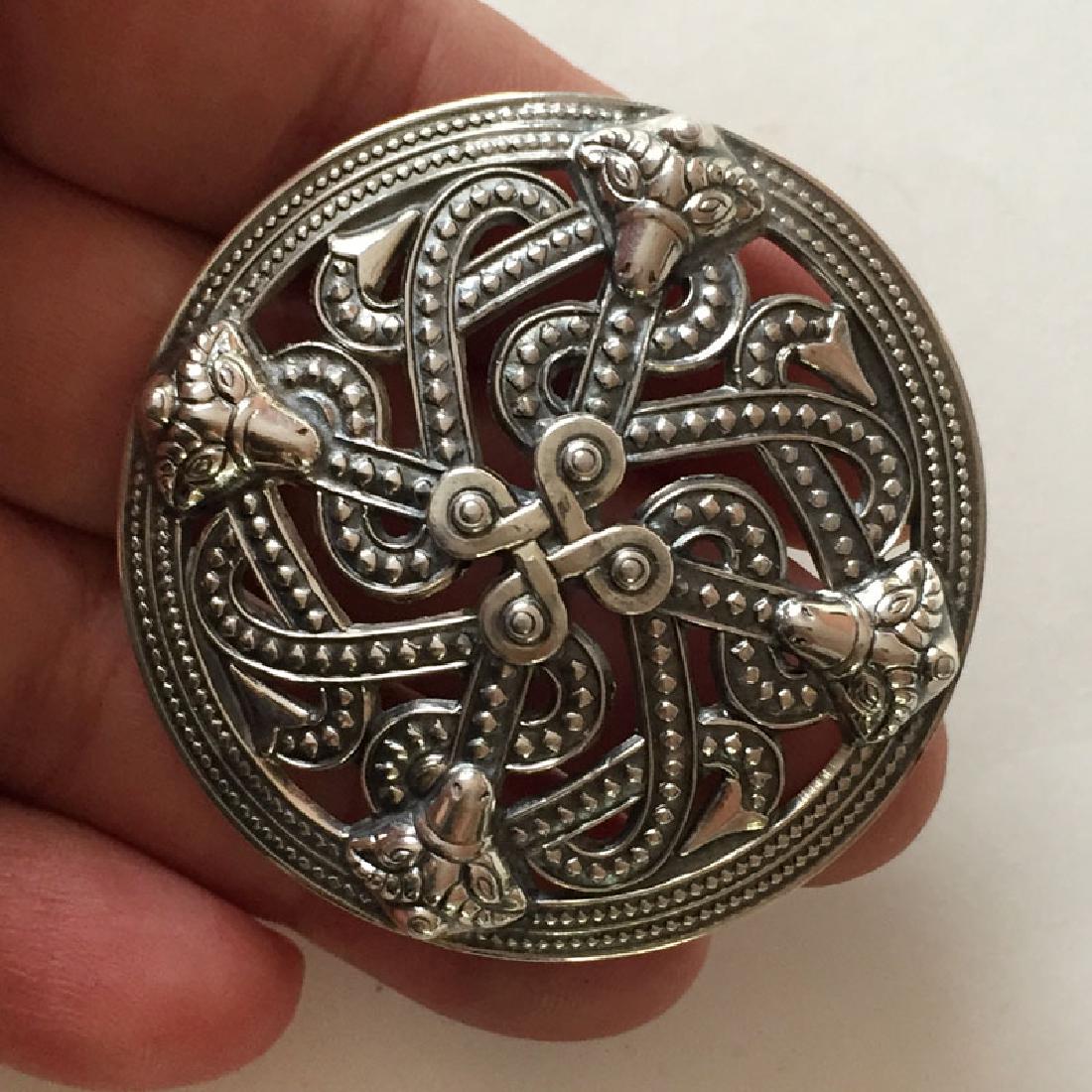 Sterling silver antique finish round abstract: Sterling silver antique finish round abstract embellishments brooch. Weight 18.7 grams. Hallmarked 925 plus 5 different symbols. Measured 2" in diameter. Condition excellent.