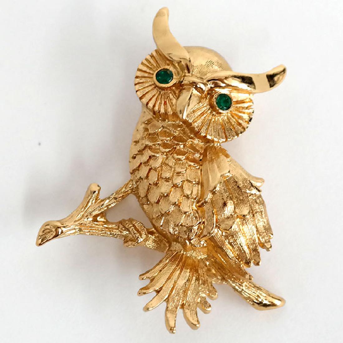 Gold plated textured OWL shaped brooch with green eyes,: Gold plated textured OWL shaped brooch with green eyes, signed MONET. Measured 1 5/8" x 1 3/8". Condition excellent.