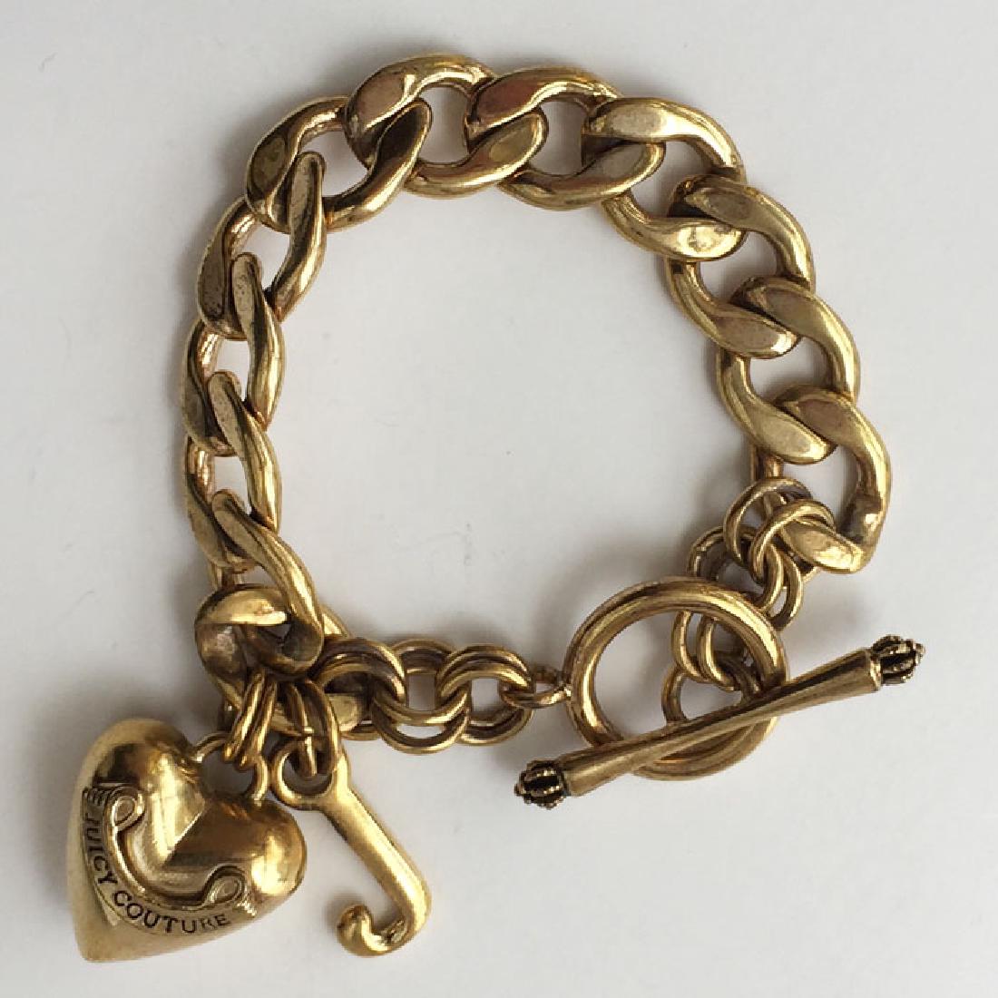 Gold plated Cuban link toggle clasp bracelet with puffy (1 of 3)