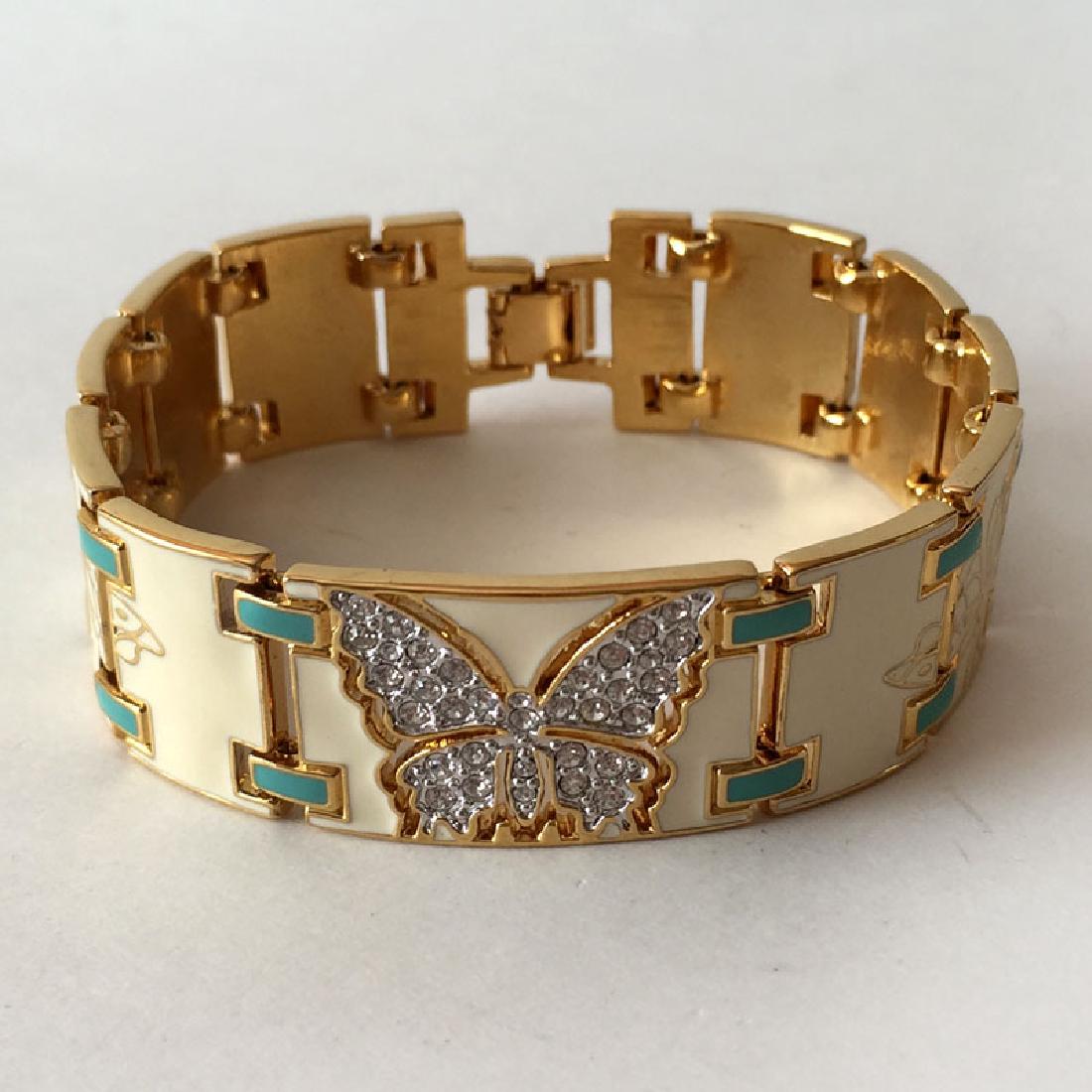 BOB MACKIE: Gold plated enameled bracelet with white: BOB MACKIE: Gold plated enameled bracelet with white rhinestones BUTTERFLY, signed. Length 7 1/2", width 3/4". Condition excellent.