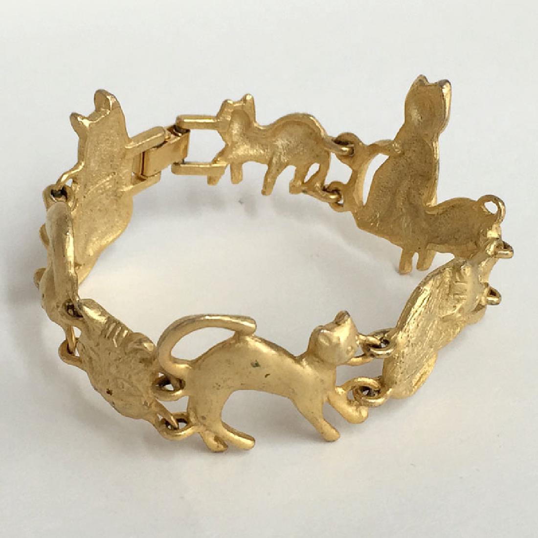 A.J.C.: Gold plated satin finish CATS shaped links (1 of 8)