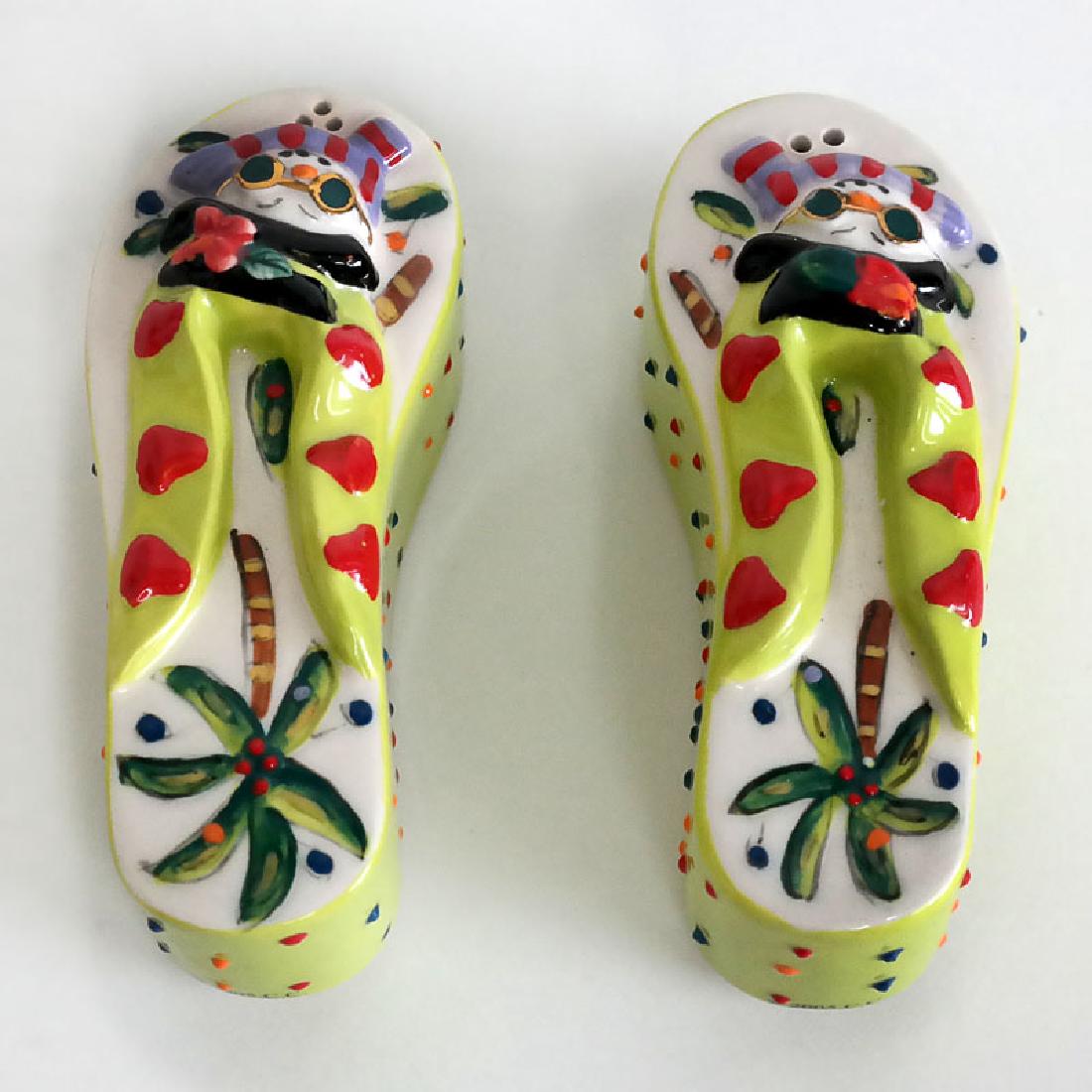 Porcelain enameled Salt and Paper shakers set in shape: Porcelain enameled Salt and Paper shakers set in shape of fancy sandals, signed CHILLIN. Length of each 3 3/4". Condition excellent.