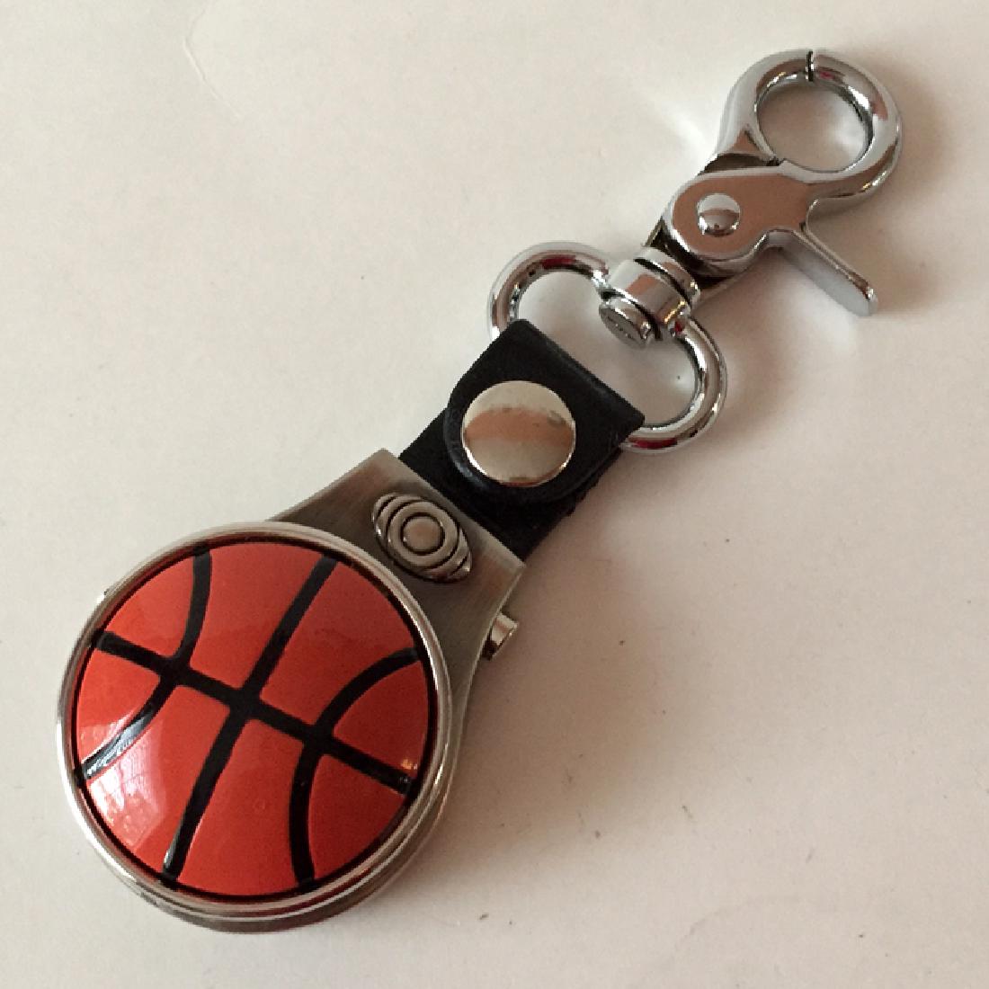 Gun metal color GENEVA round pocket watch / keychain: Gun metal color GENEVA round pocket watch / keychain with jumbo lobster clasp and orange color baseball shaped cover-lid. Watch with Japan movement and stainless steel back. Case measured 40 mm in dia