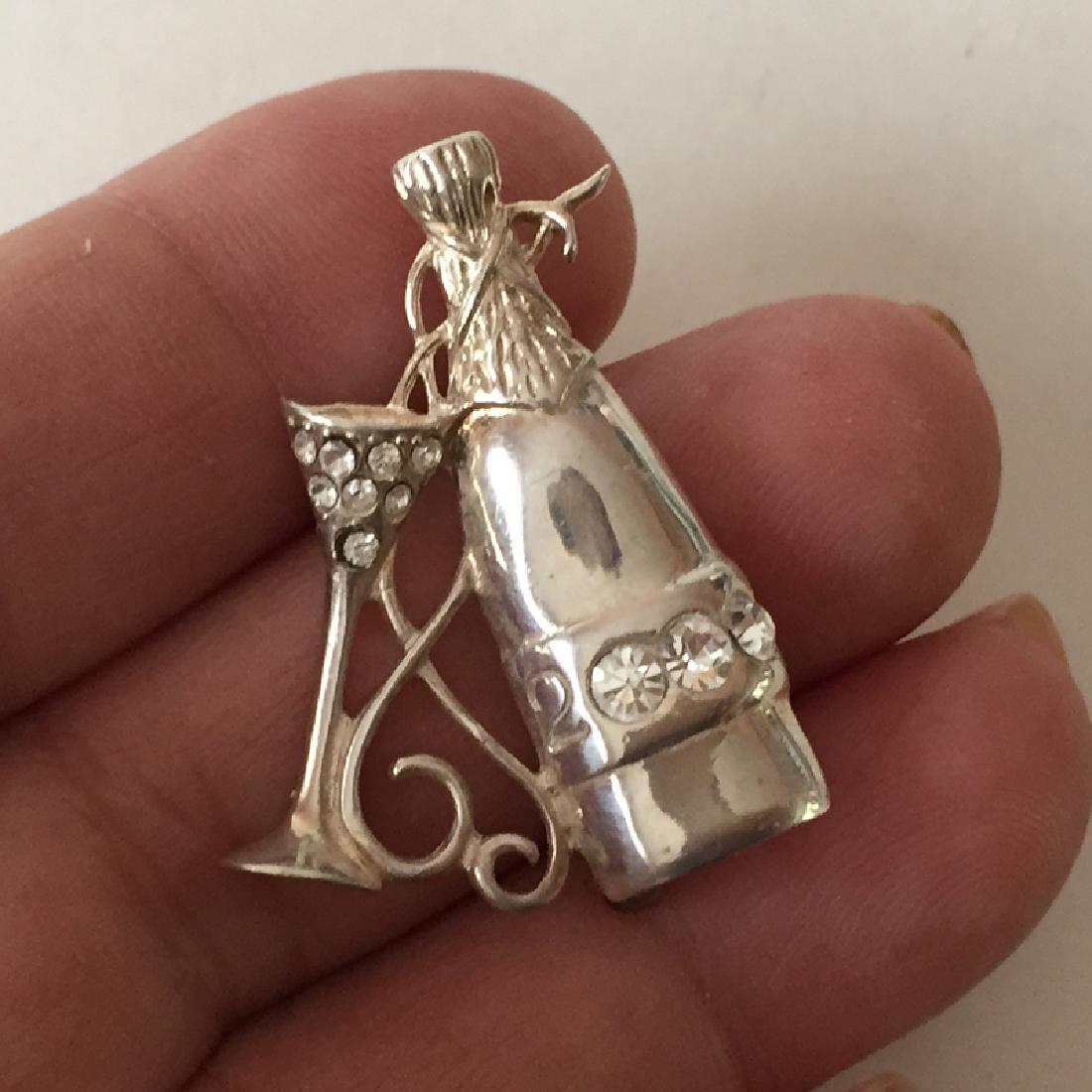Js: Sterling silver CHAMPAGNE 2000 BOTTLE shaped brooch (1 of 3)
