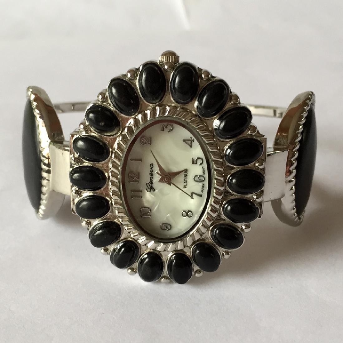 Cuff style bracelet with oval shape watch with MOP dial (1 of 6)