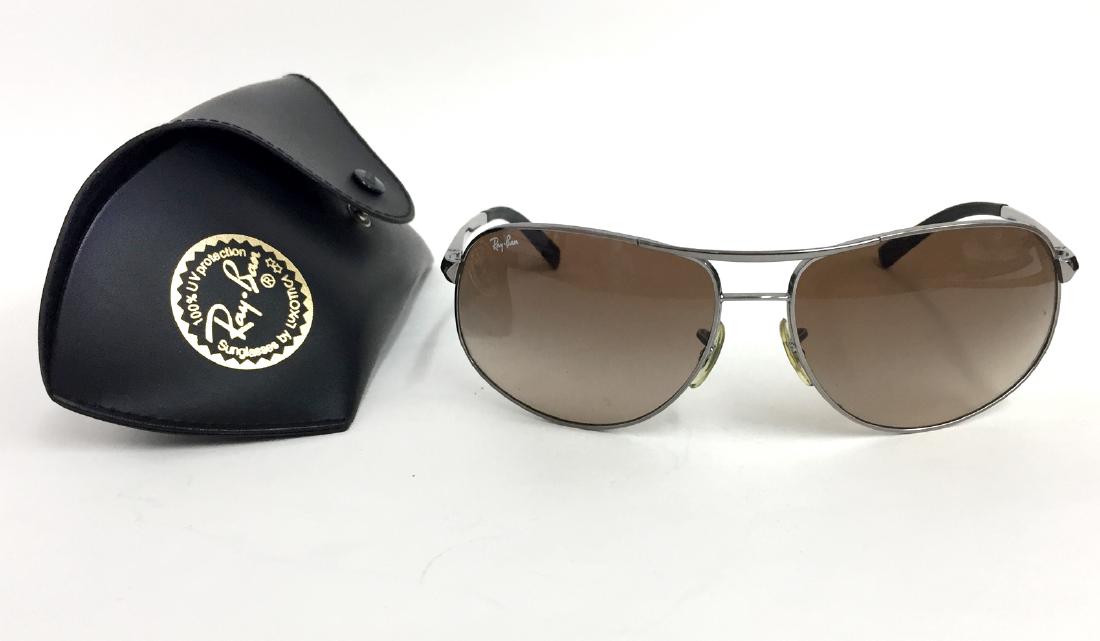 Authentic RAY BAN RB3387 sunglasses 004/13 64-15: Authentic RAY BAN RB3387 sunglasses 004/13 64-15 aviator style gun metal frame with brown gradient lenses in original black leather case. Sunglasses have etched letters RB on lense, signed lenses fr