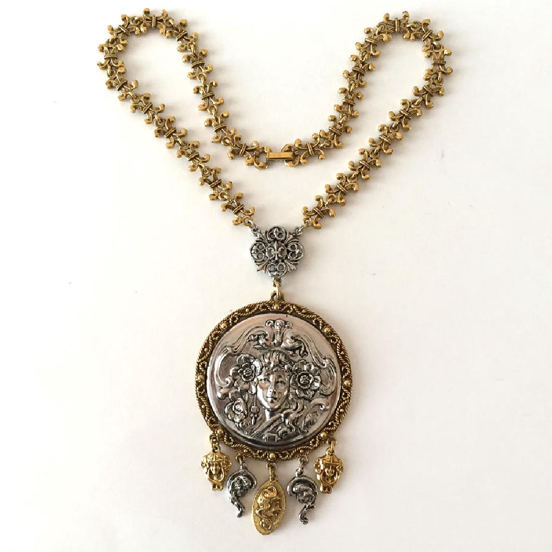 Vintage two tone necklace - round pendant with ancient: Vintage two tone necklace - round pendant with ancient faces charms and fancy chain. Length of pendant with bail 4 3/8" and chain 16". Condition excellent.