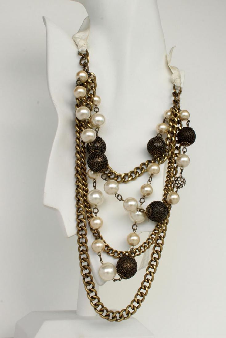 Antique color Cuban link chain with white round faux: Antique color Cuban link chain with white round faux pearls and round covered with mesh metal hollow beads with spacers necklace with ribbon as a clasp. Length adjustable. Shortest part of chain measu